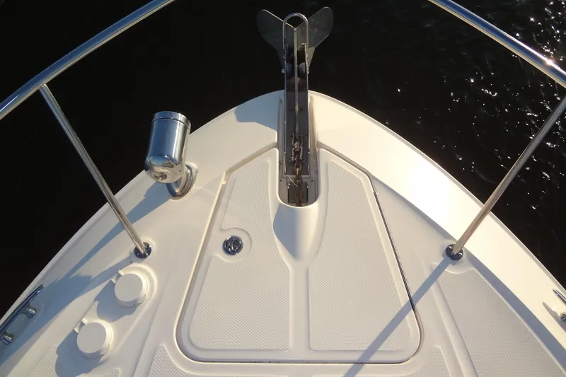 Slide: The Image of Bow of 2017 Sea Ray Sundancer 350 with anchor and railing, on calm water. - 35