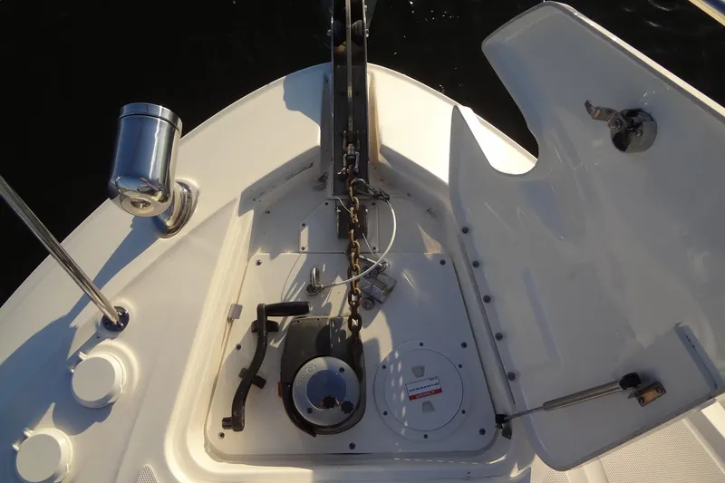 Slide: The Image of 2017 Sea Ray Sundancer 350 anchor system with open hatch and chain mechanism. - 36