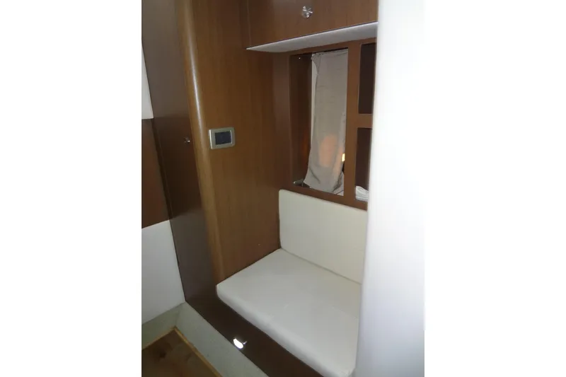 Slide: The Image of Interior seating area of 2017 Sea Ray Sundancer 350 yacht with wooden paneling. - 48