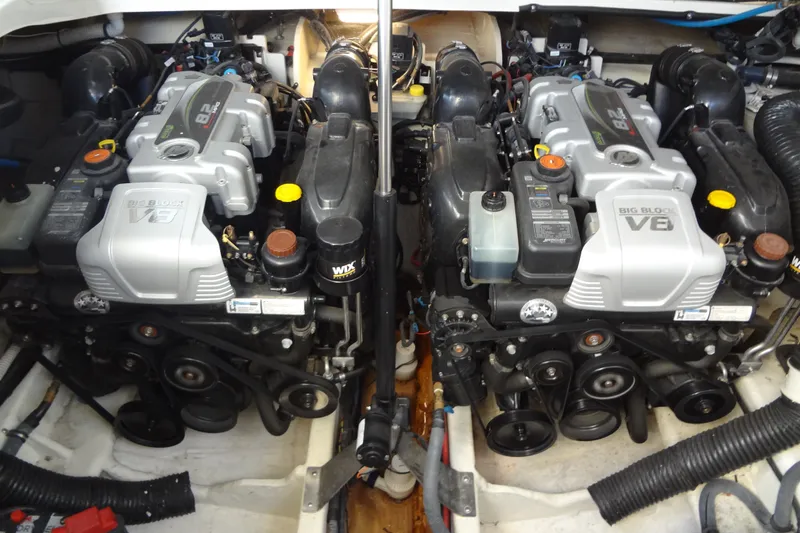 Slide: The Image of Engine compartment of a 2017 Sea Ray Sundancer 350 with dual V8 engines. - 54