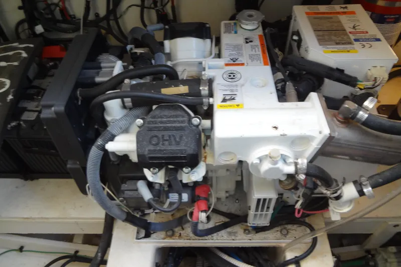 Slide: The Image of Engine compartment of a 2017 Sea Ray Sundancer 350 boat, showcasing mechanical components. - 57