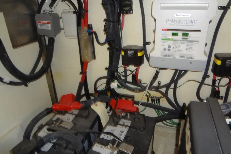 Slide: The Image of Electrical system of a 2017 Sea Ray Sundancer 350 boat, featuring batteries and wiring. - 58