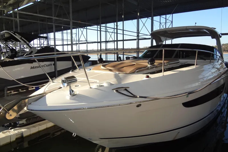 Slide: The Image of 2017 Sea Ray Sundancer 350 yacht docked in marina, sleek design, luxury features. - 60