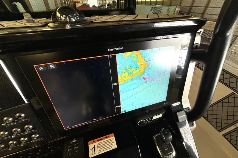 Slide: The Image of Raymarine navigation display on 2019 Wellcraft 302 Fisherman boat dashboard. - 25