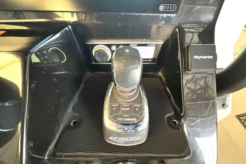 Slide: The Image of 2019 Wellcraft 302 Fisherman boat control panel with joystick and Raymarine system. - 26