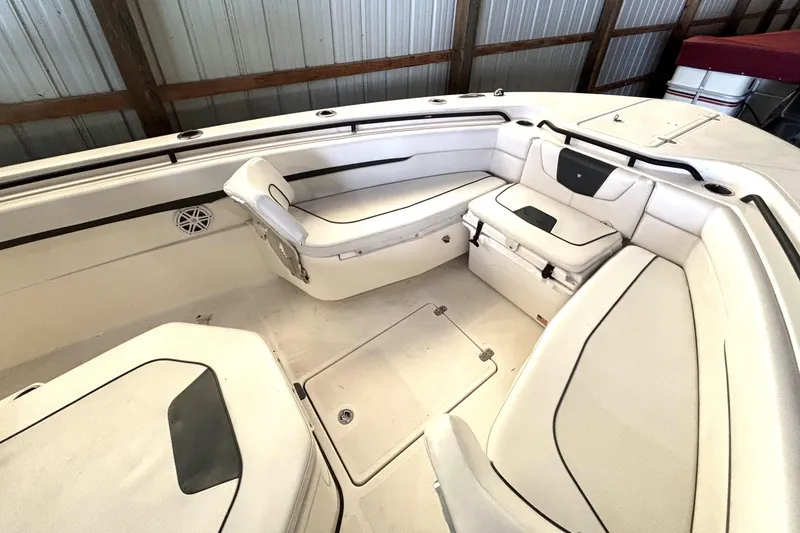 Slide: The Image of 2019 Wellcraft 302 Fisherman boat interior with cushioned seating and storage compartments. - 31