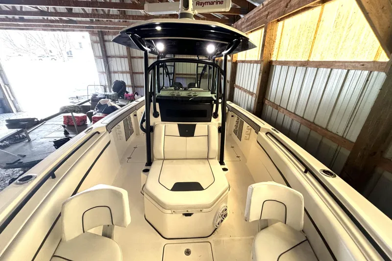 Slide: The Image of 2019 Wellcraft 302 Fisherman boat interior in a wooden storage shed. - 33