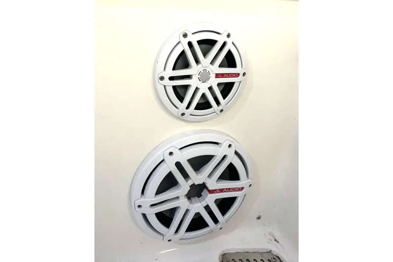 Slide: The Image of White JL Audio speakers on a 2019 Wellcraft 302 Fisherman boat. - 45