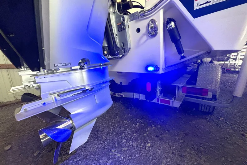Slide: The Image of 2019 Wellcraft 302 Fisherman boat with illuminated blue lights on trailer. - 6