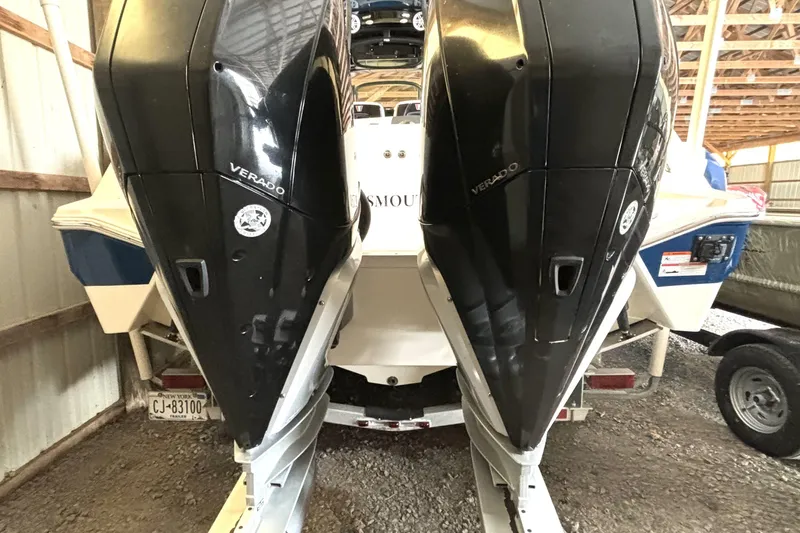 Slide: The Image of 2019 Wellcraft 302 Fisherman boat with dual Verado engines in storage. - 7