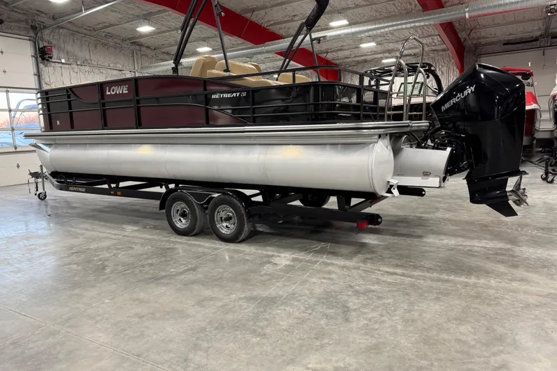 Slide: The Image of 2018 Lowe Retreat 250 RFL pontoon boat with Mercury engine in a showroom. - 3
