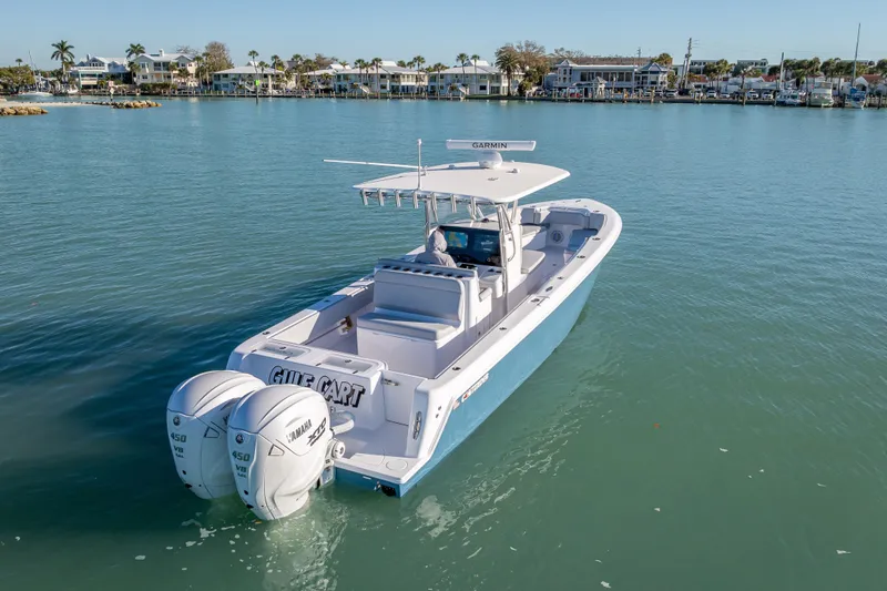 Slide: The Image of 2026 Contender 35 ST boat with twin Yamaha engines on calm water. - 11