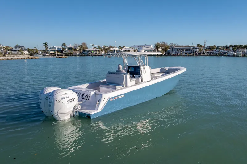 Slide: The Image of 2026 Contender 35 ST boat with twin Yamaha engines on calm water. - 13
