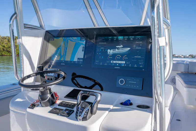 Slide: The Image of 2026 Contender 35 ST boat dashboard with advanced navigation and control systems. - 19