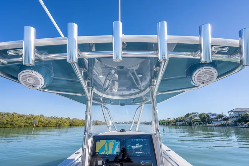 Slide: The Image of 2026 Contender 35 ST boat with advanced navigation system and sleek design on calm waters. - 21