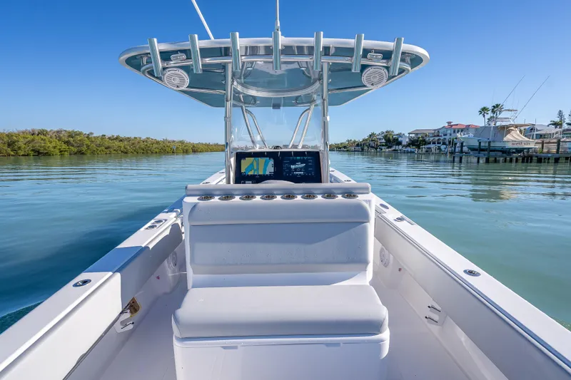 Slide: The Image of 2026 Contender 35 ST boat on calm water, featuring sleek design and advanced navigation system. - 22