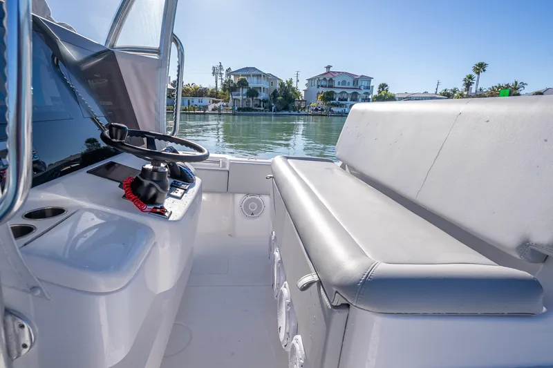 Slide: The Image of Interior view of 2026 Contender 35 ST boat, featuring helm and seating area. - 27