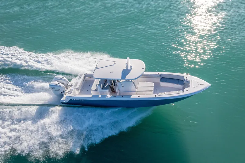 Slide: The Image of 2026 Contender 35 ST boat cruising on clear turquoise water. - 3