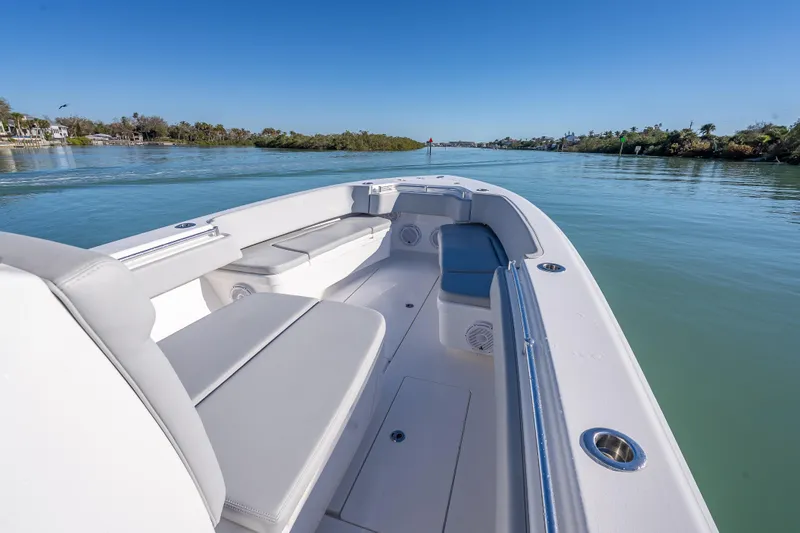 Slide: The Image of 2026 Contender 35 ST boat interior with sleek seating on calm water. - 34