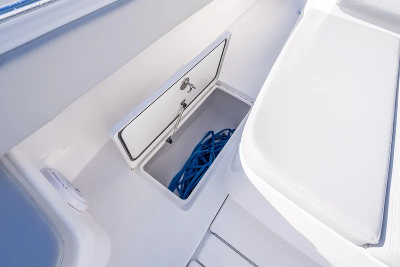 Slide: The Image of 2026 Contender 35 ST boat storage compartment with blue rope inside. - 43