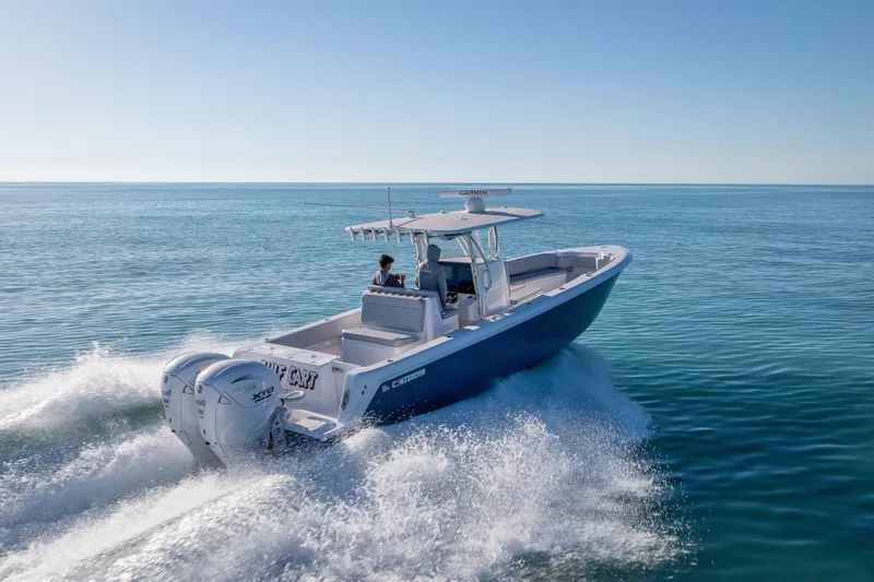 Slide: The Image of 2026 Contender 35 ST boat cruising on open water, showcasing powerful twin engines. - 5