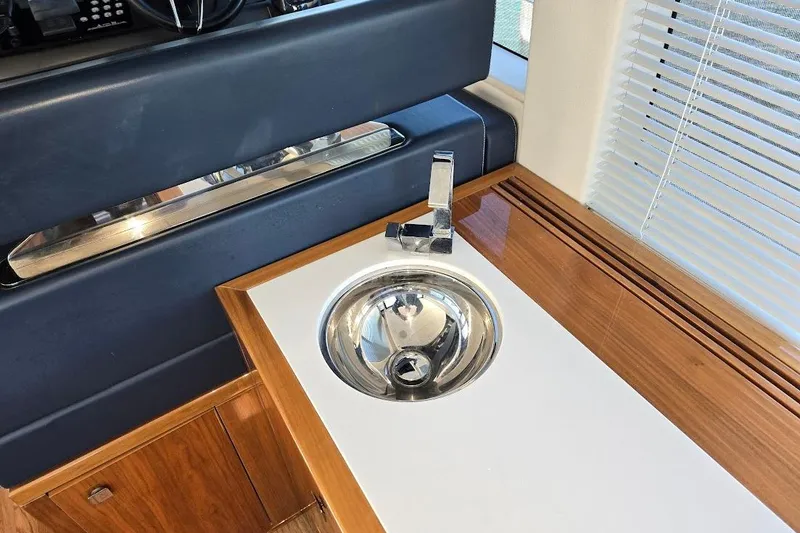 Slide: The Image of Luxurious interior sink on 2019 Sunseeker Predator 50 yacht with wooden cabinetry. - 27