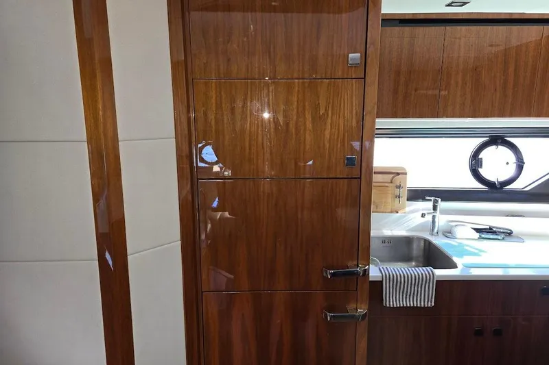 Slide: The Image of Luxurious interior of 2019 Sunseeker Predator 50 yacht with sleek wood finish. - 33