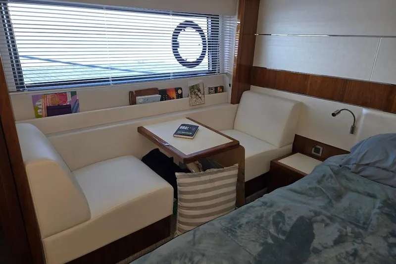 Slide: The Image of Luxurious interior of 2019 Sunseeker Predator 50 yacht with cozy seating and table. - 43