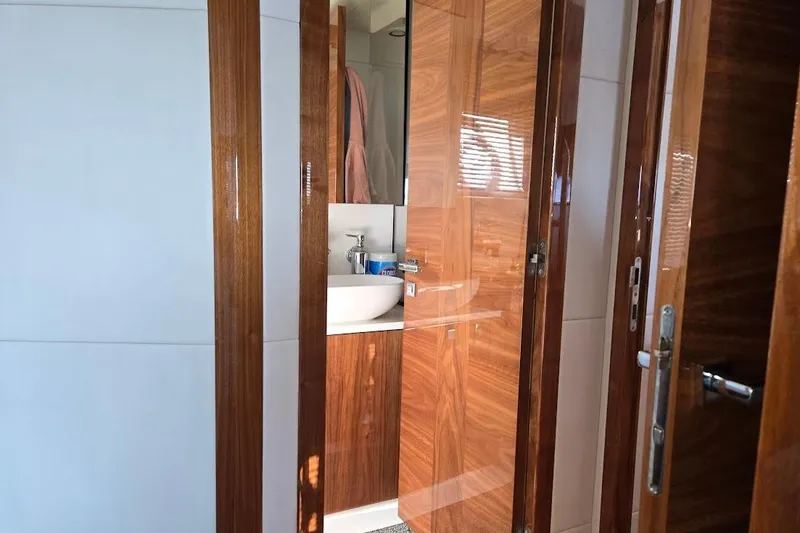 Slide: The Image of Luxurious wooden interior of 2019 Sunseeker Predator 50 yacht bathroom. - 44