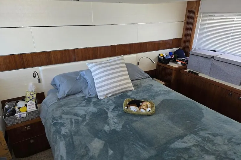 Slide: The Image of Luxurious bedroom interior of 2019 Sunseeker Predator 50 yacht with plush bedding and modern decor. - 5