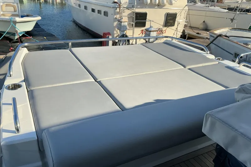 Slide: The Image of Sunseeker Predator 50 yacht sunbed, 2019 model, docked at marina. - 62