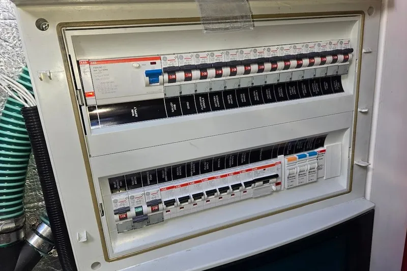 Slide: The Image of Electrical panel on a 2019 Sunseeker Predator 50 yacht, featuring circuit breakers. - 76