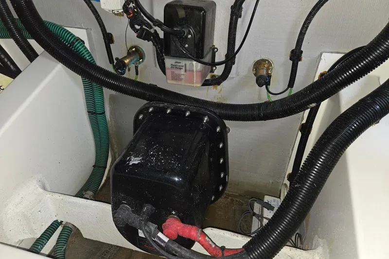 Slide: The Image of Engine compartment of a 2019 Sunseeker Predator 50 yacht, showing wiring and components. - 77