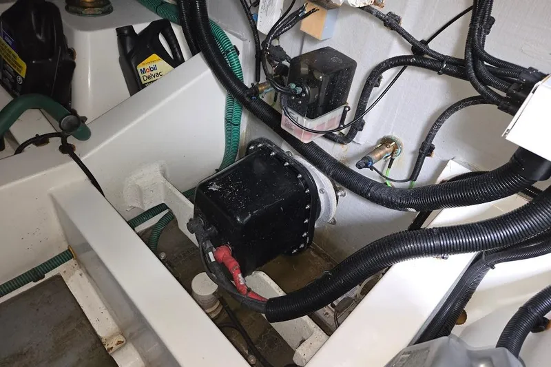 Slide: The Image of Engine compartment of 2019 Sunseeker Predator 50 yacht with visible wiring and components. - 78
