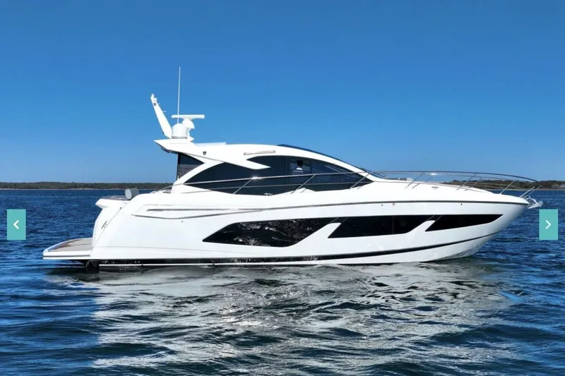 Slide: The Image of 2019 Sunseeker Predator 50 yacht cruising on open water under clear blue skies. - 88