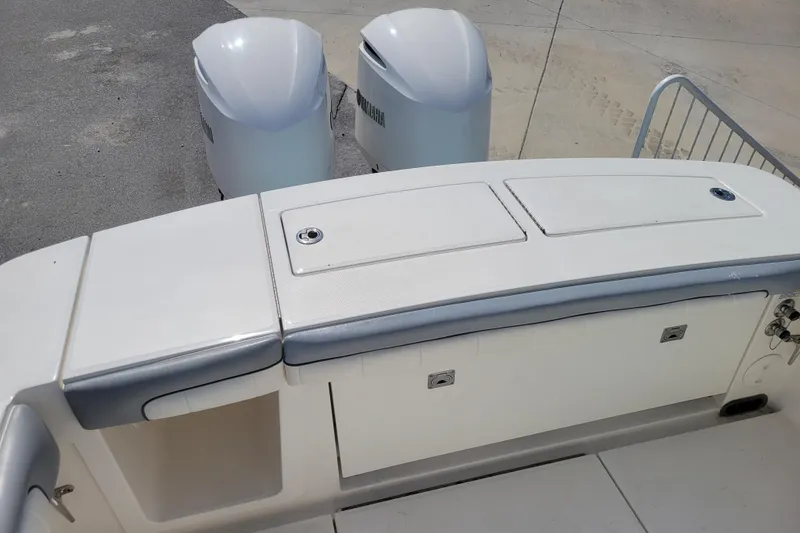 Slide: The Image of 2018 Regulator 28 Forward Seating boat with dual Yamaha engines, rear seating view. - 6