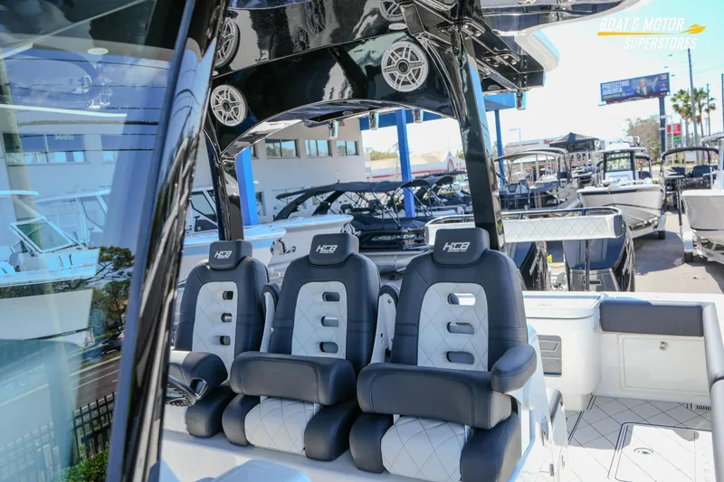 Slide: The Image of Control panel on 2023 HCB 39 Speciale boat, featuring engine switches. - 103