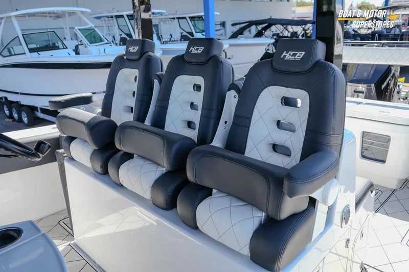 Slide: The Image of 2023 HCB 39 Speciale boat interior with dual outboard engines and seating area. - 105