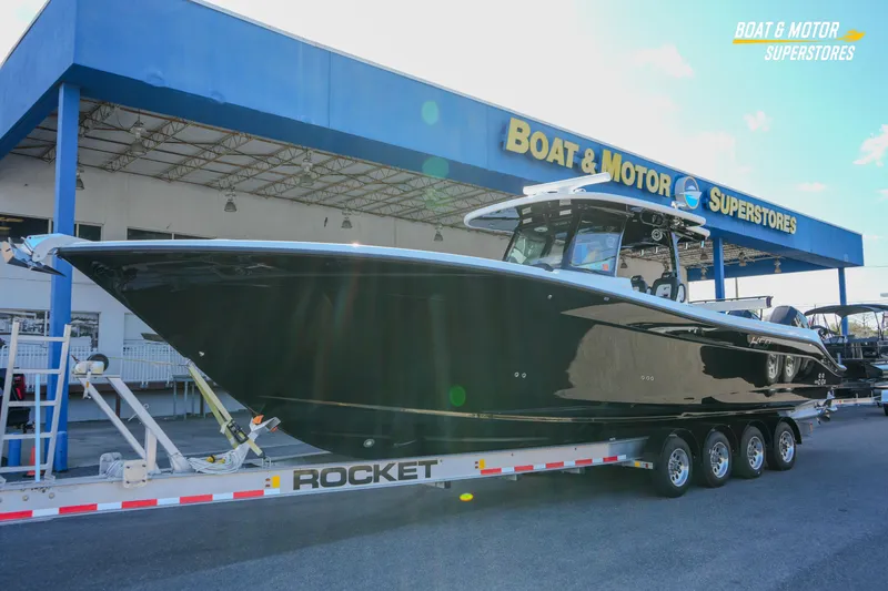 Slide: The Image of 2023 HCB 39 Speciale boat on trailer at dealership, Boat & Motor Superstores. - 14