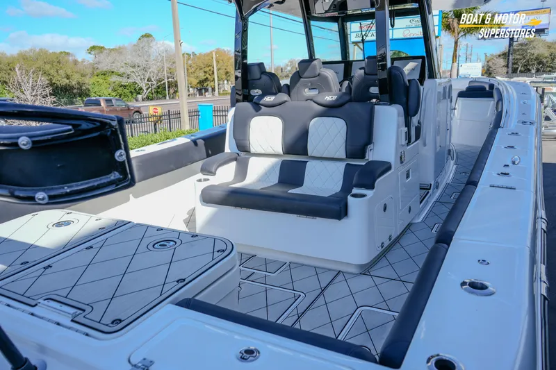 Slide: The Image of 2023 HCB 39 Speciale boat deck with compass design and storage compartments. - 22