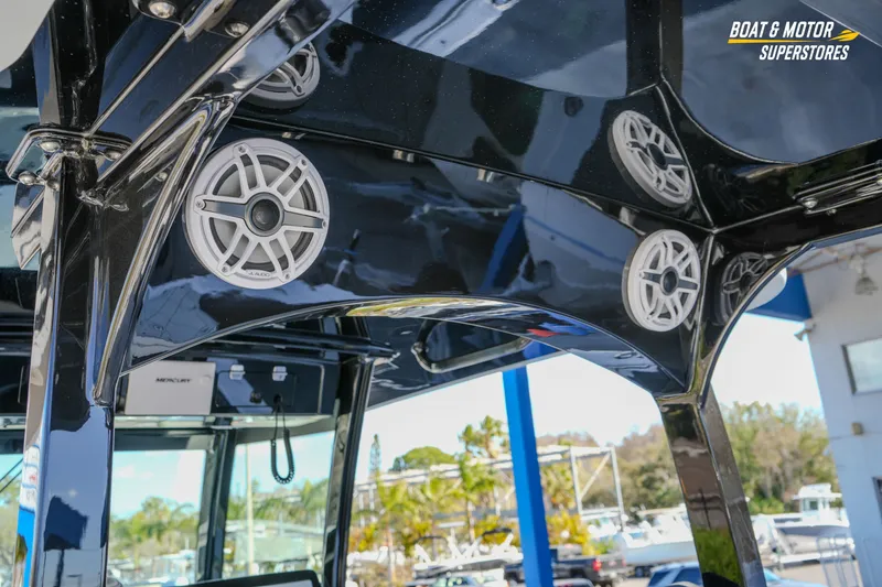 Slide: The Image of 2023 HCB 39 Speciale boat cockpit with Garmin displays and leather seating. - 32