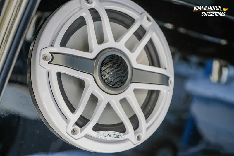 Slide: The Image of 2023 HCB 39 Speciale boat cockpit with Garmin displays and modern steering controls. - 33