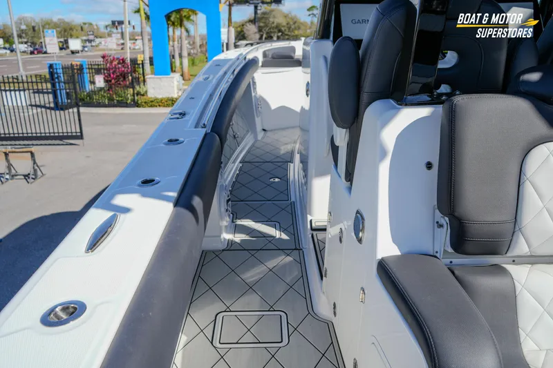Slide: The Image of 2023 HCB 39 Speciale boat interior with Garmin navigation displays and luxurious seating. - 35