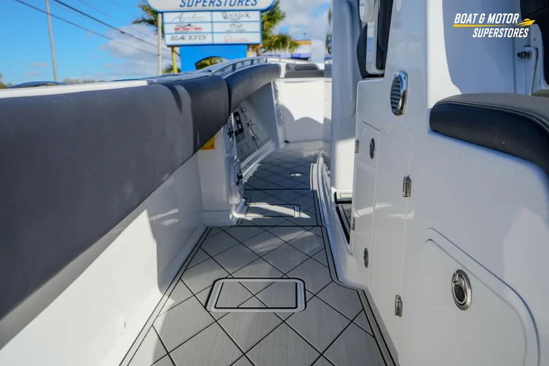 Slide: The Image of 2023 HCB 39 Speciale boat dashboard with Garmin navigation screens and steering wheel. - 36