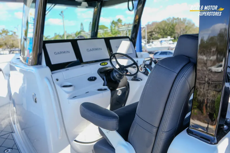 Slide: The Image of 2023 HCB 39 Speciale boat dashboard with Garmin navigation displays. - 37