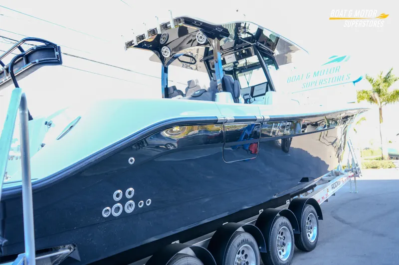 Slide: The Image of 2023 HCB 39 Speciale boat on trailer at Boat & Motor Superstores. - 5