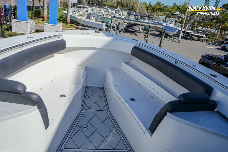 Slide: The Image of 2023 HCB 39 Speciale boat with luxurious seating at a dealership. - 52