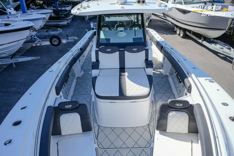 Slide: The Image of 2023 HCB 39 Speciale boat interior with open storage compartment and luxury seating. - 56