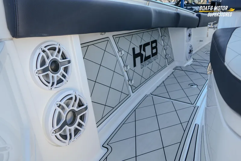 Slide: The Image of 2023 HCB 39 Speciale boat with sleek design and advanced features at a dealership. - 59