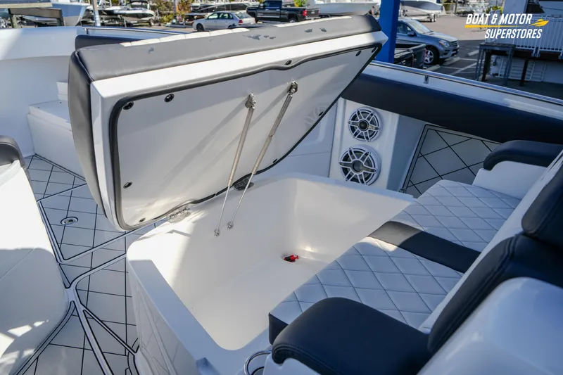 Slide: The Image of 2023 HCB 39 Speciale boat interior with luxury seating and steering console. - 61